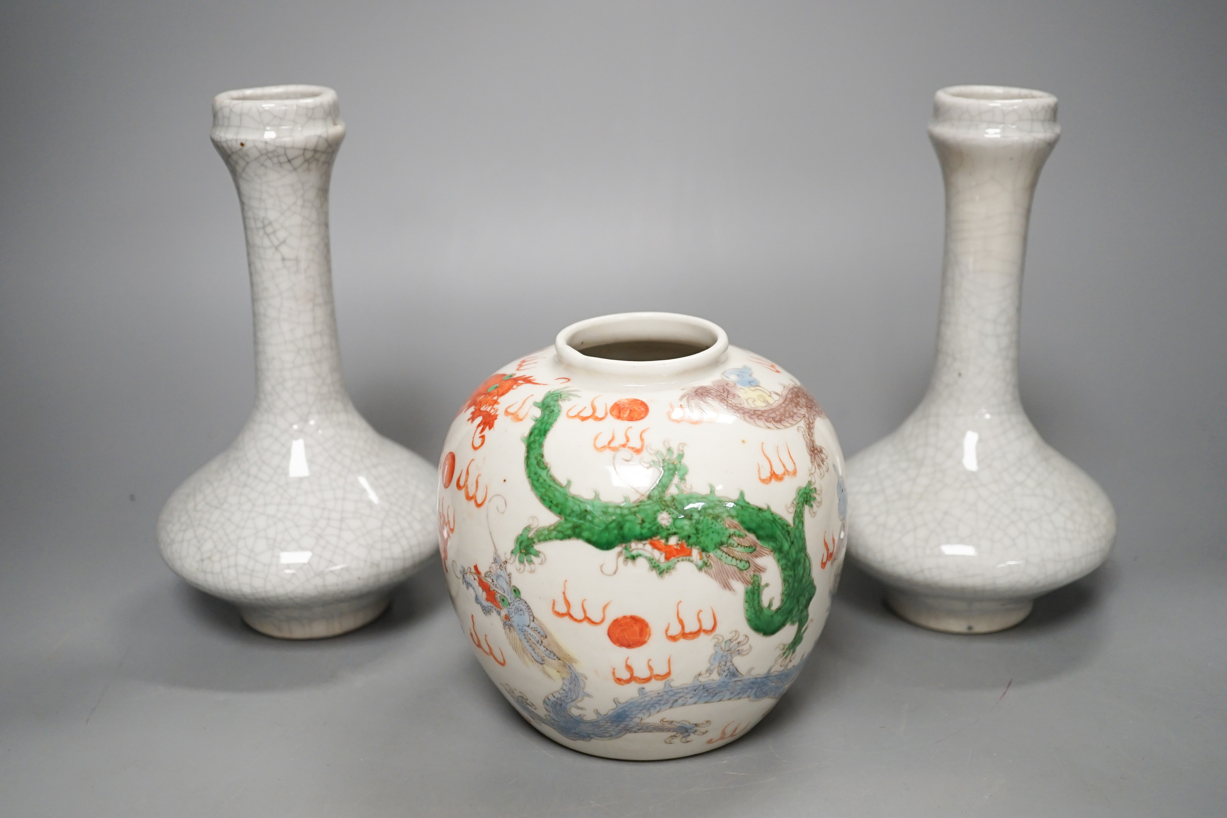 A Chinese enamelled porcelain 'dragon' jar and two crackleglaze bottle vases, tallest 19cm